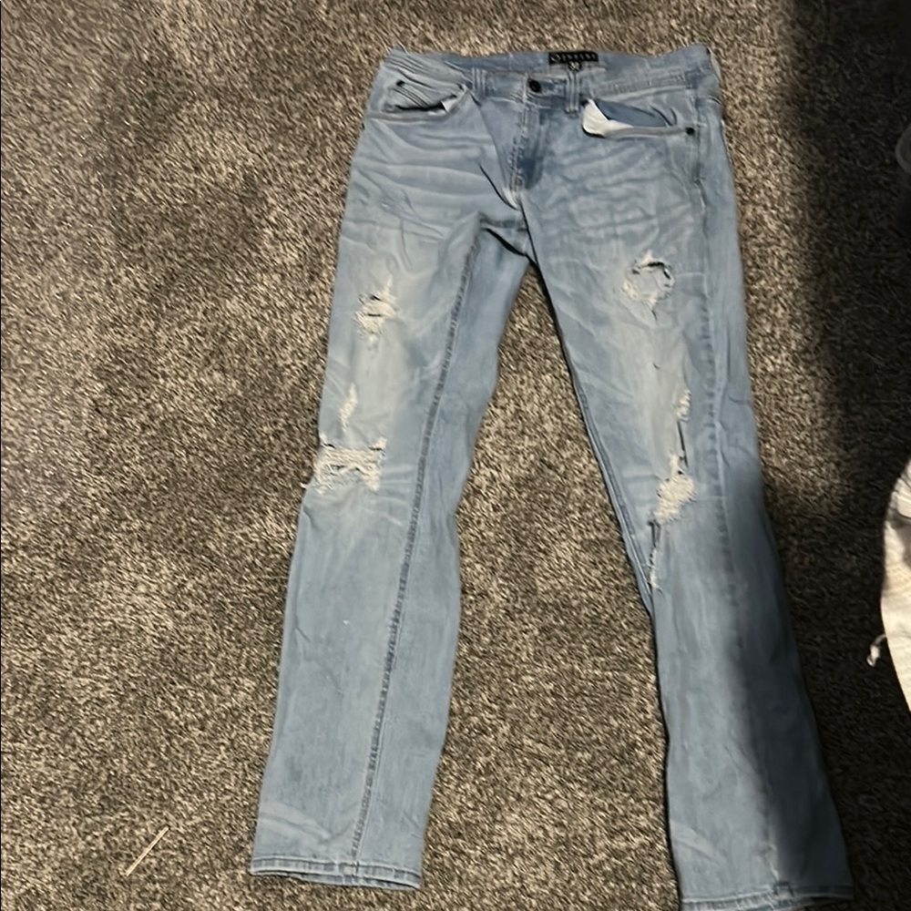 Distressed Light Blue Denim Jeans